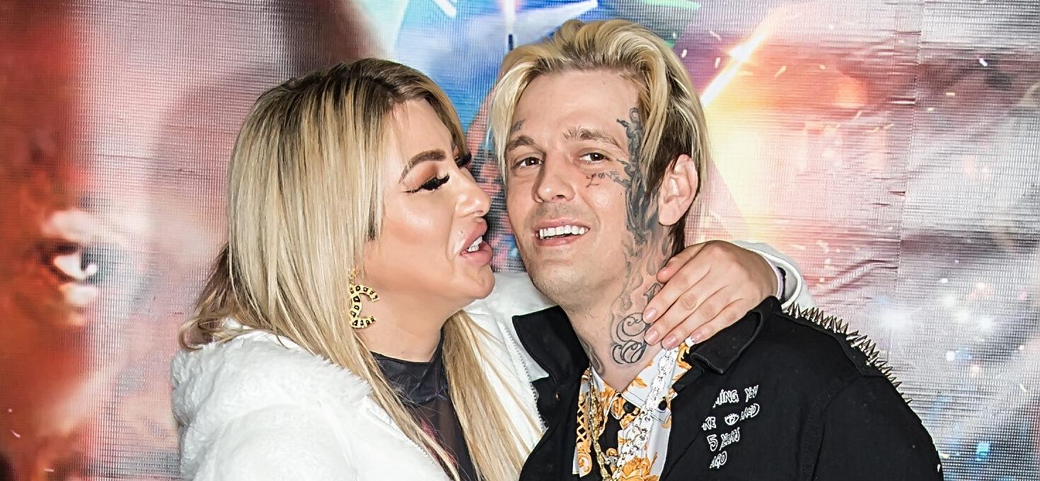 Melanie Martin and Aaron Carter smiling.