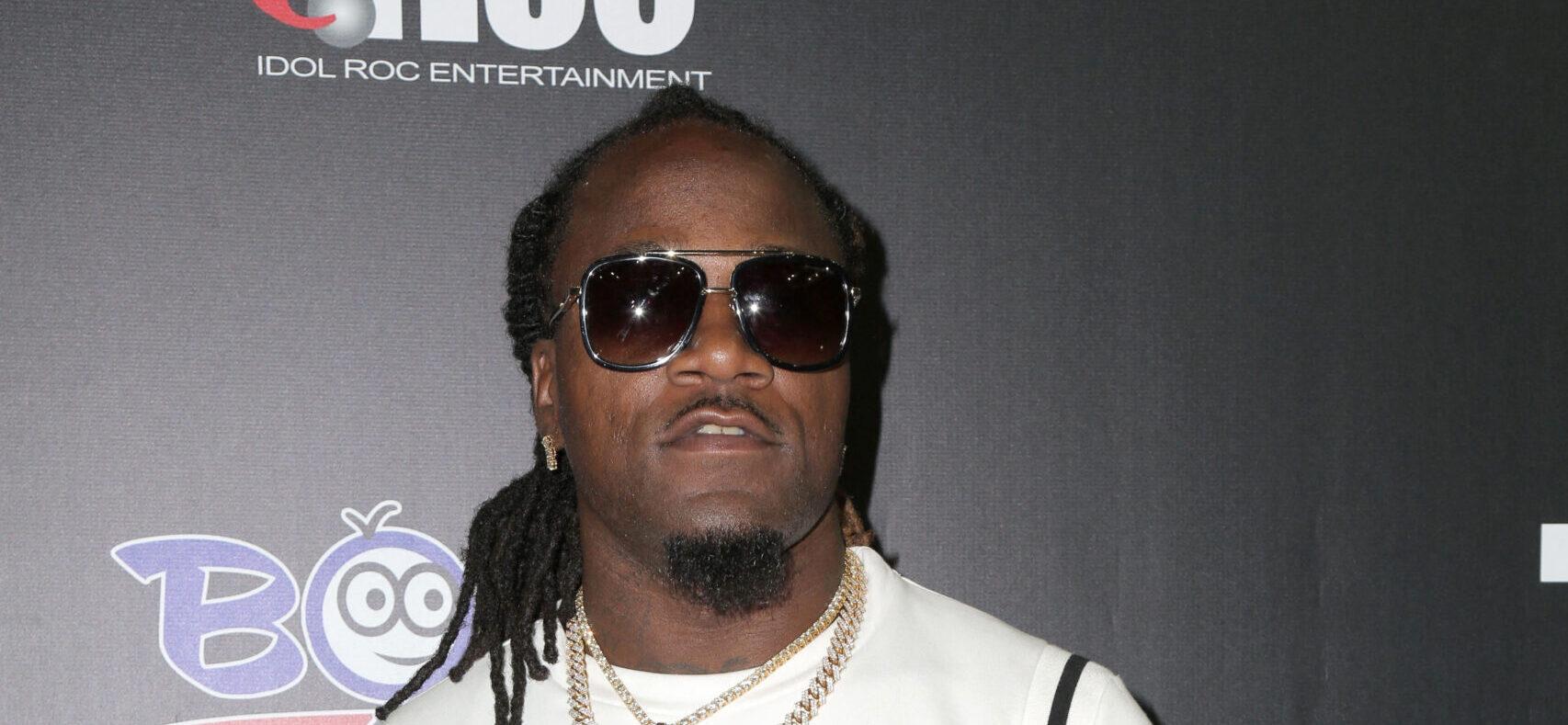 Adam Jones posing on the red carpet.